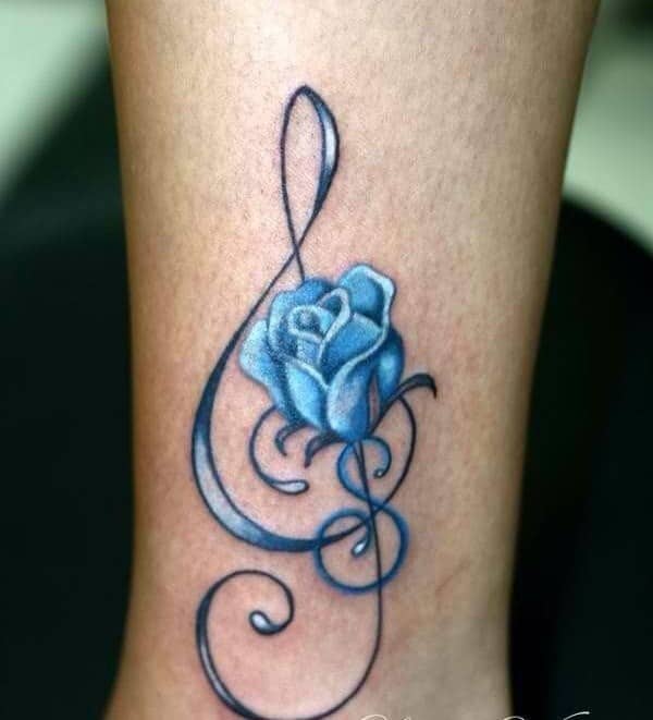 Blue rose tattoo on the wrist.