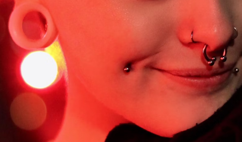 Cheek dimple piercings